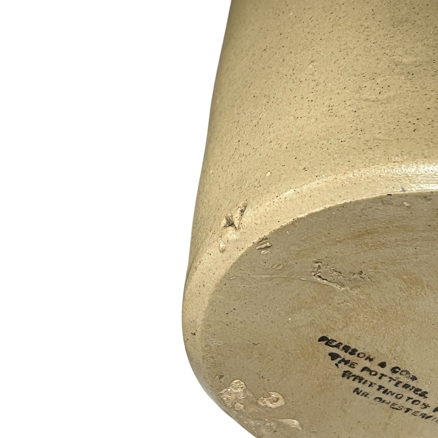 close up of a ww1 SRD jar base with a makers stamp on a white background 