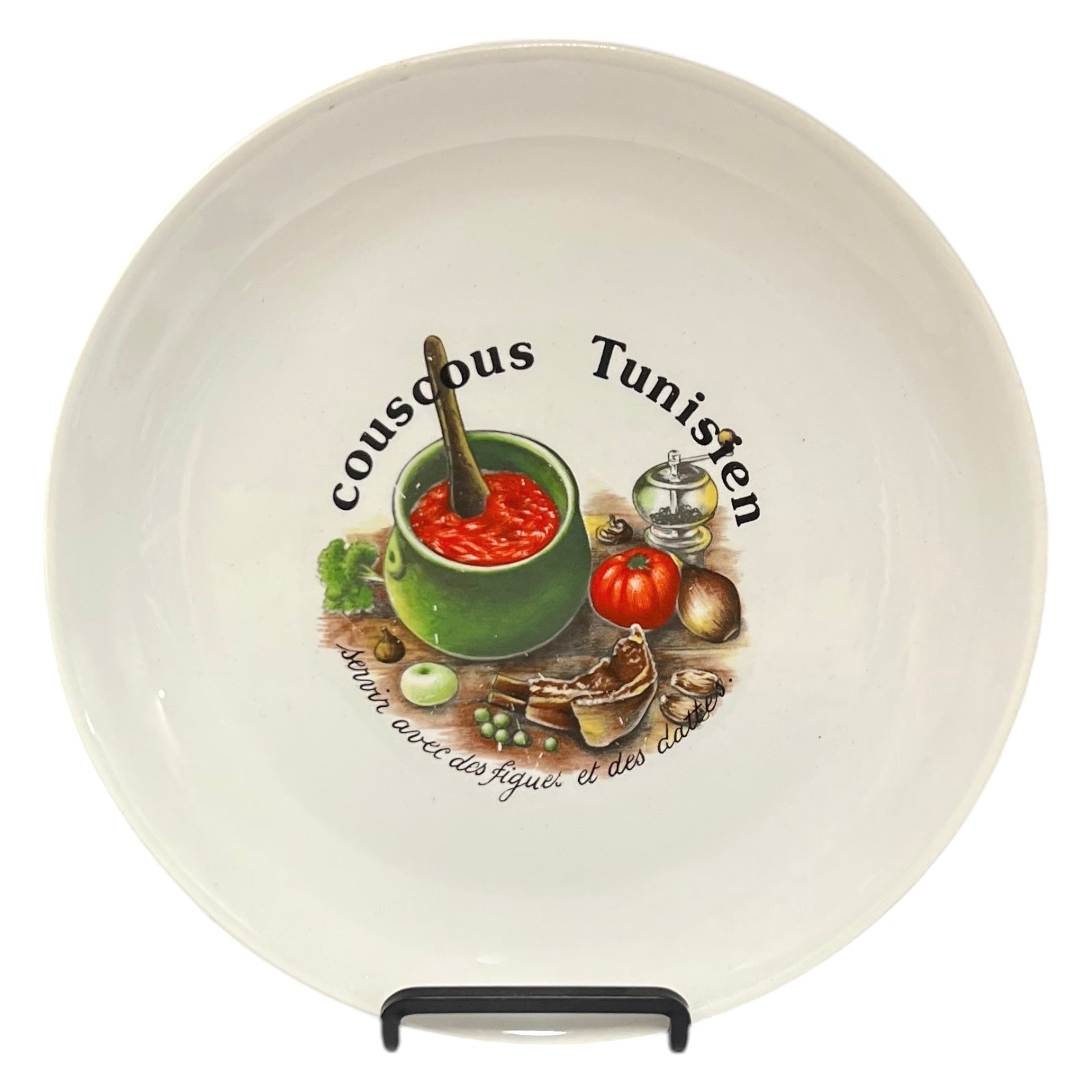 Ceramic plate with Tunisian couscous design and text on a white background