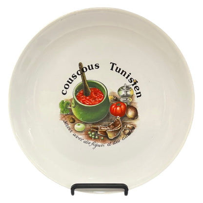 Ceramic plate with Tunisian couscous design and text on a white background