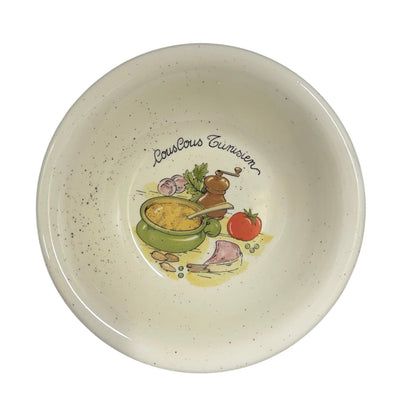 Ceramic bowl with 'Couscous Tunisien' design on a white background