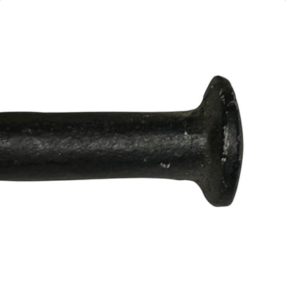 close up of cast iron toiler roll holder on a white background