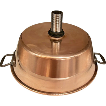 Close up of French copper bowl upcycled into a copper sink with cast iron handles on a white background