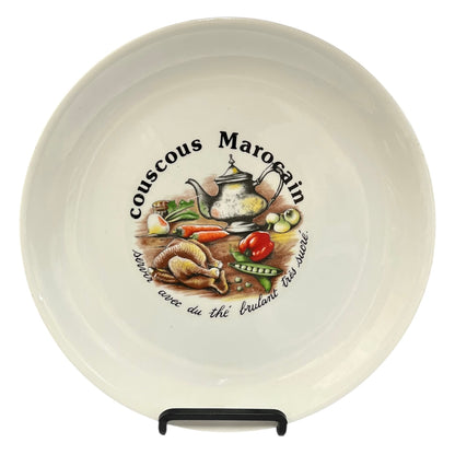 Ceramic plate with decorative design and text on a white background