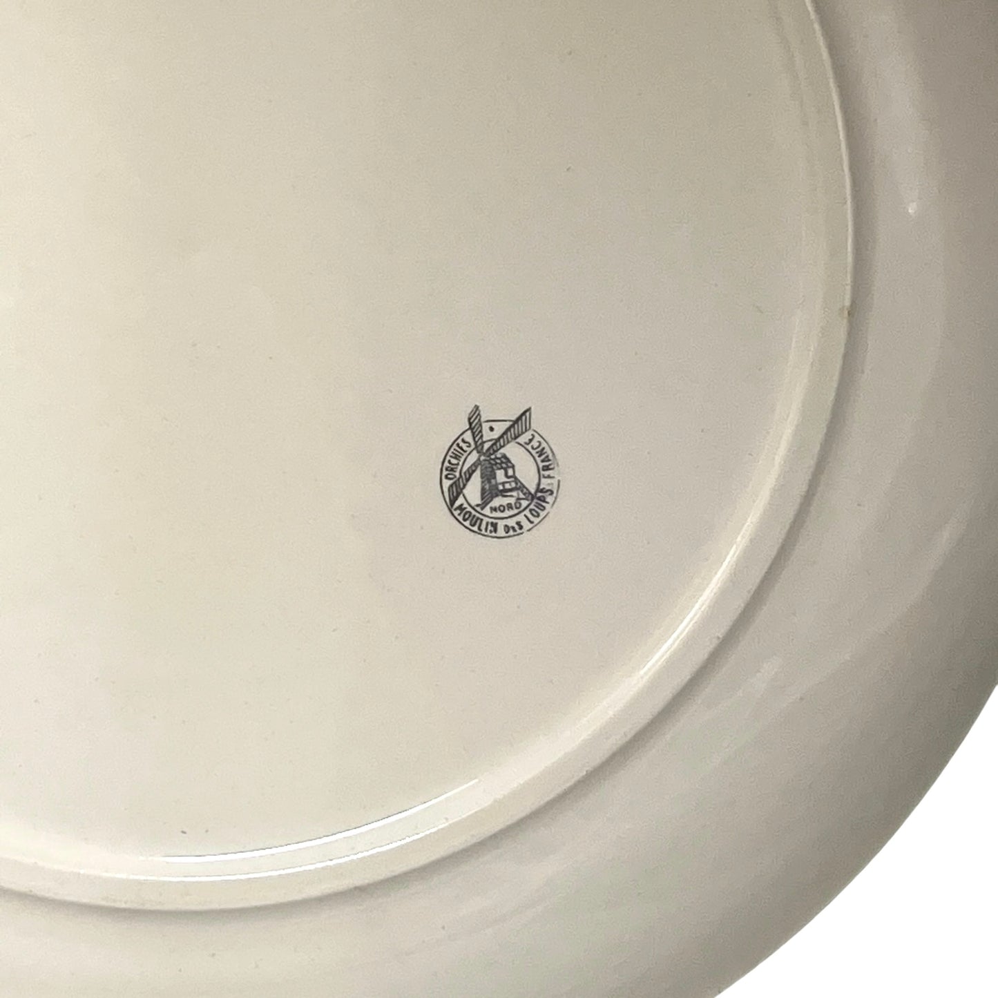 White ceramic plate with a logo on a white background
