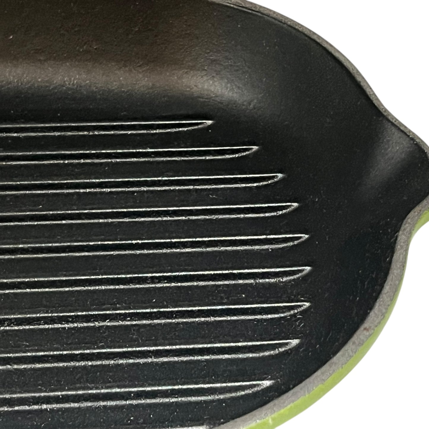 Close-up of a black cast iron skillet with ribbed surface