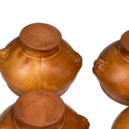 Brown ceramic bowls on a white background