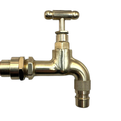 Brass faucet on a white background
