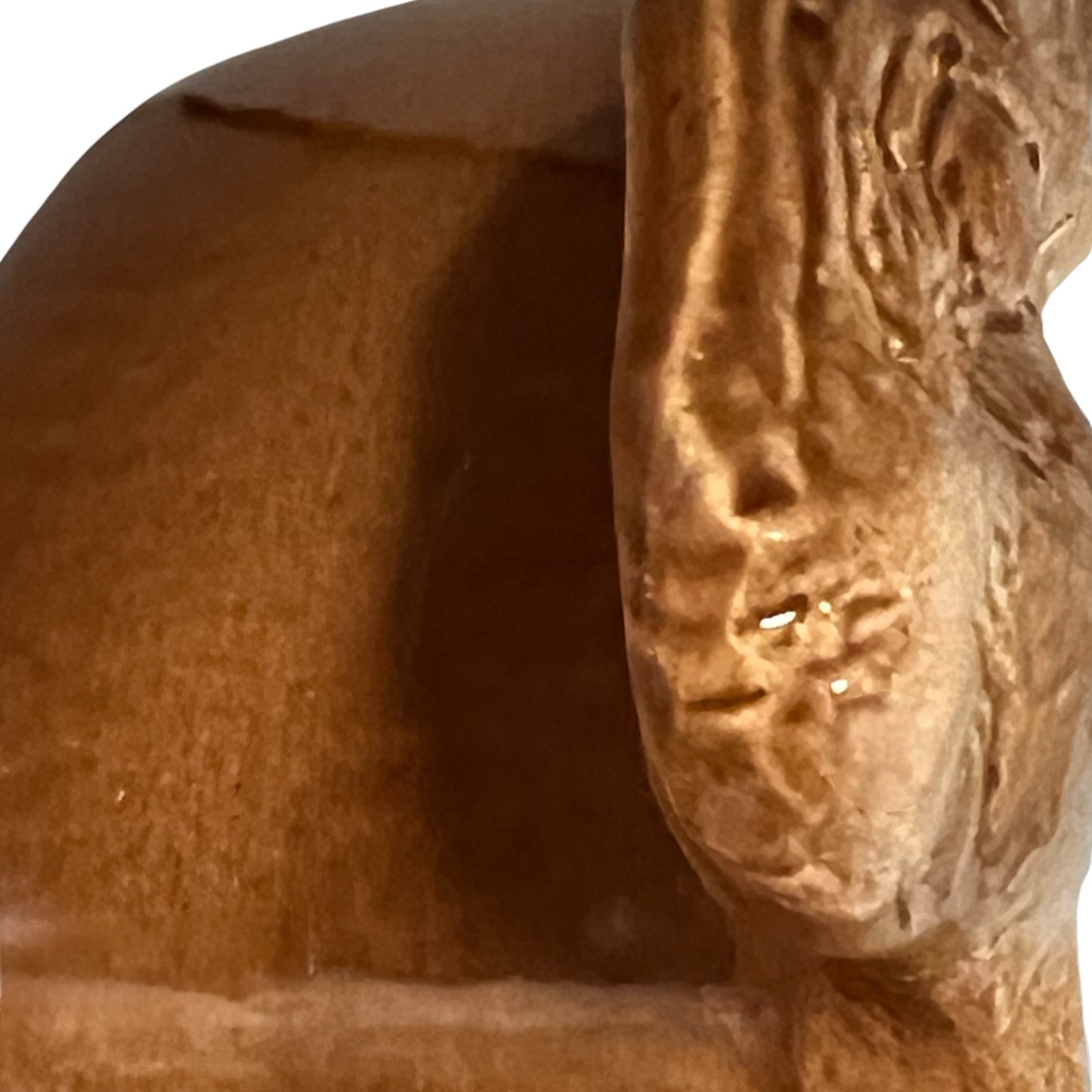 Close up of a rabbit shaped casserole dish on a white background
