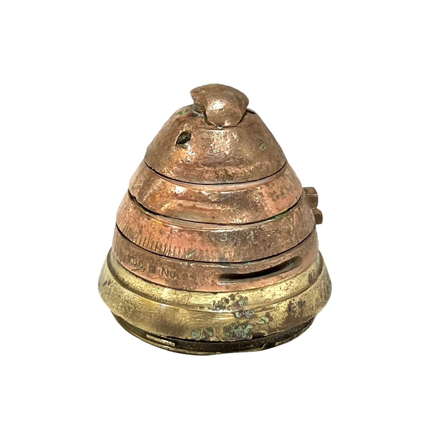 WW1 brass fuse paperweight on a white background