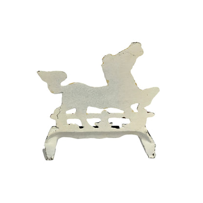 A distressed white metal decorative stand shaped like a poodle, shown against a plain white background.