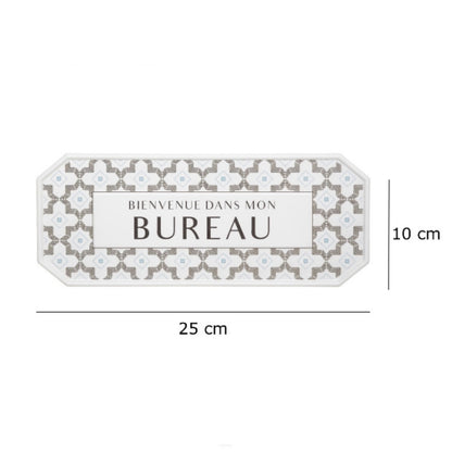 Decorative sign with floral pattern and text 'BIENVENUE DANS MON BUREAU' on a white background