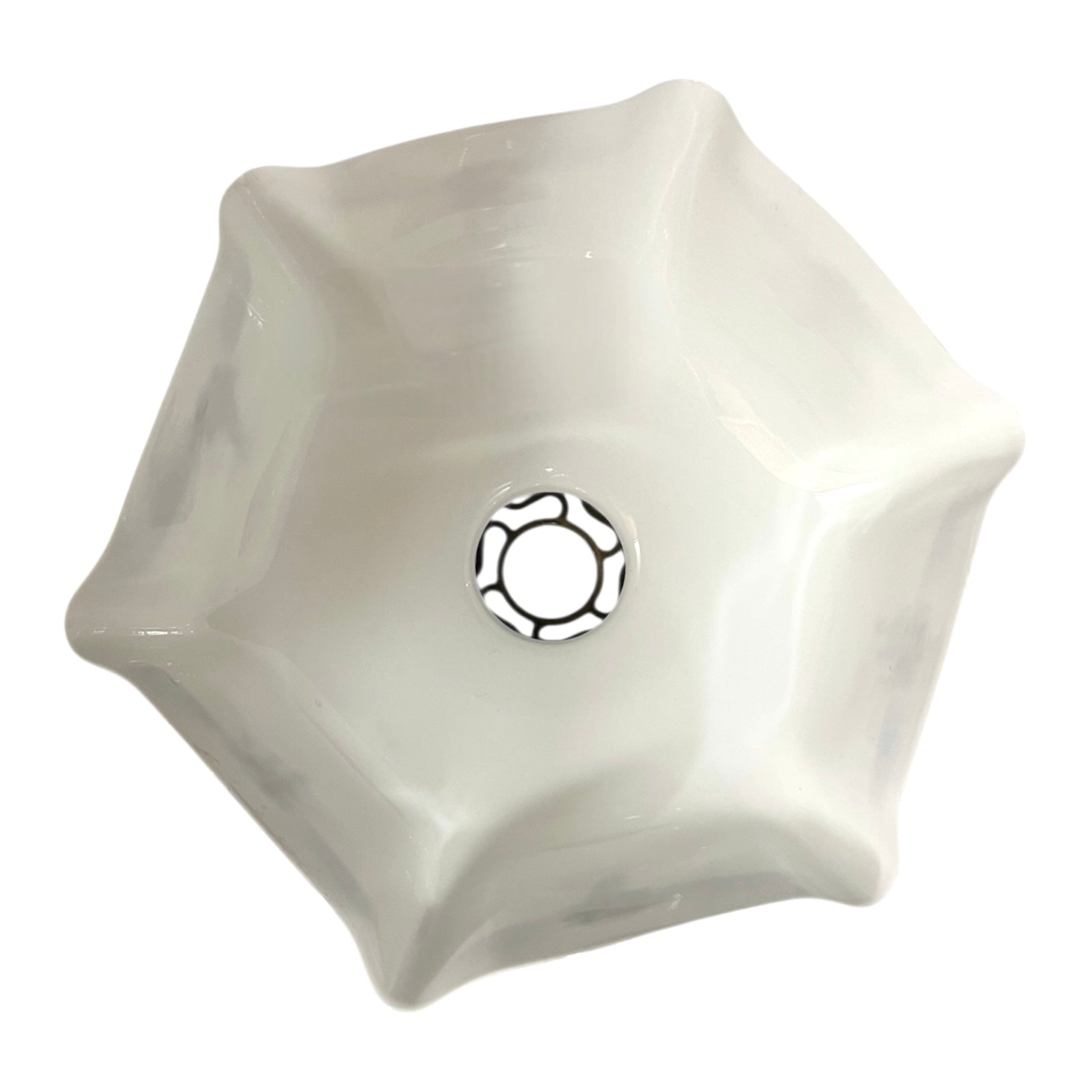 Close up of a white glass lamp shade with decorative design on a white background