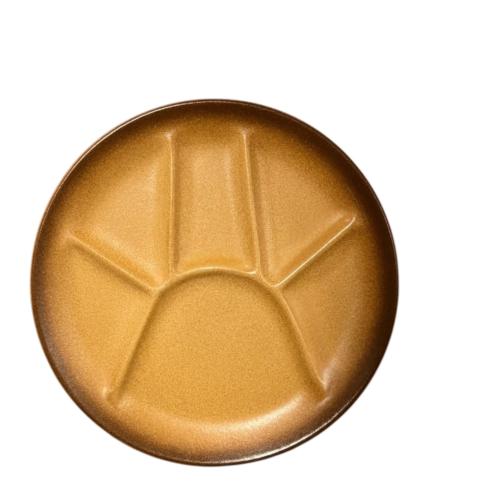 brown-coloured plate with divided sections and textured surface on a white background