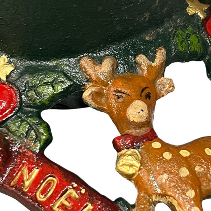 Close up of cast iron Christmas Tree holder on a white background