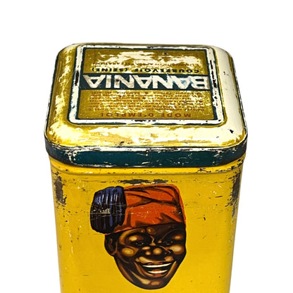 Vintage tin can with a colourful design featuring a face and 'Banania' branding on a white background.