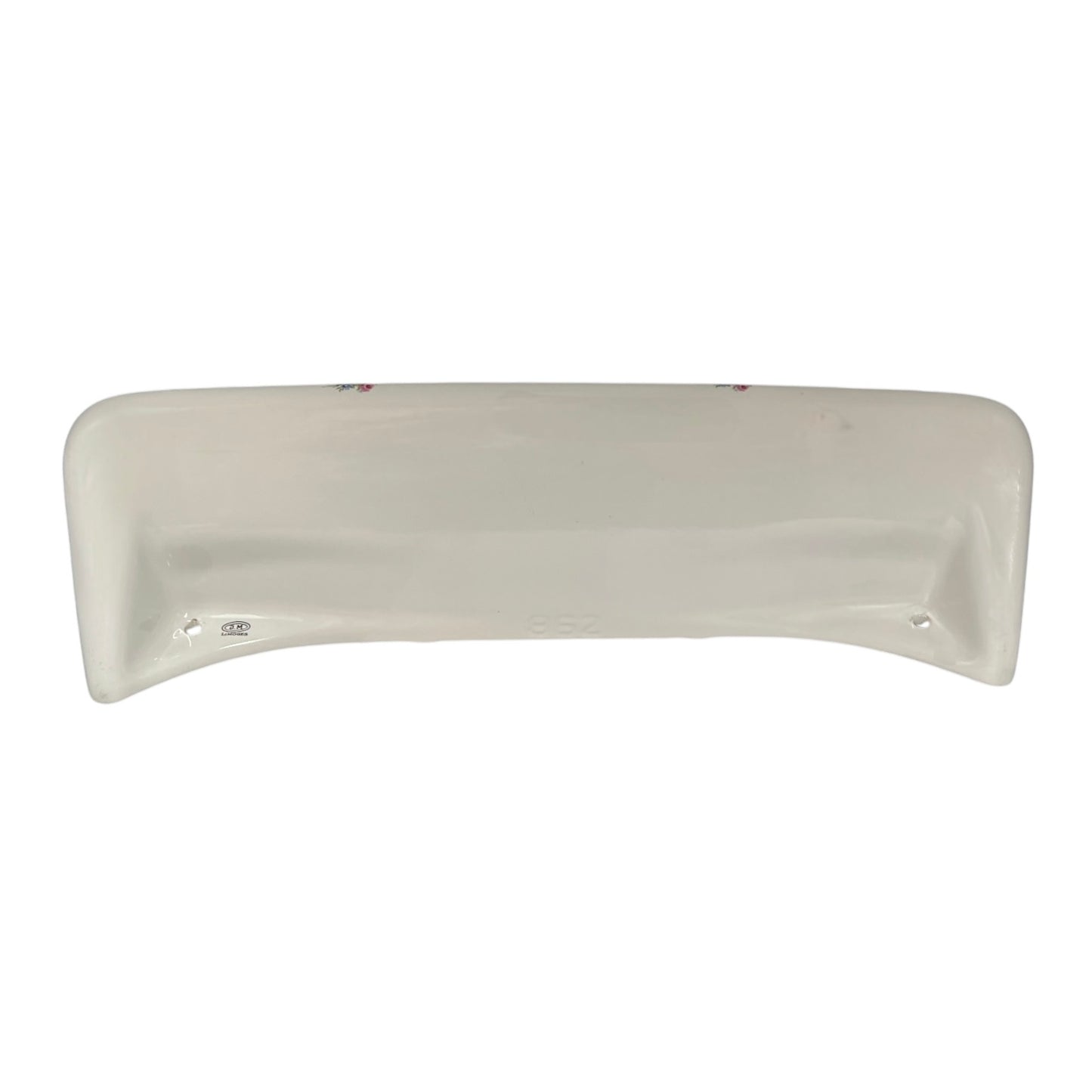 A curved, off-white ceramic underside of a shelf, shown against a plain white background