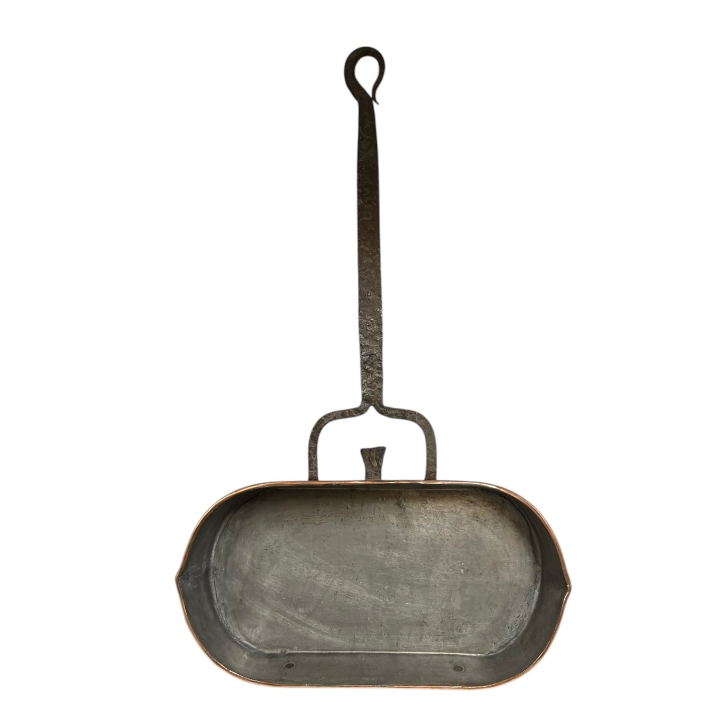 Antique French copper roasting pan with a long handle on a white background