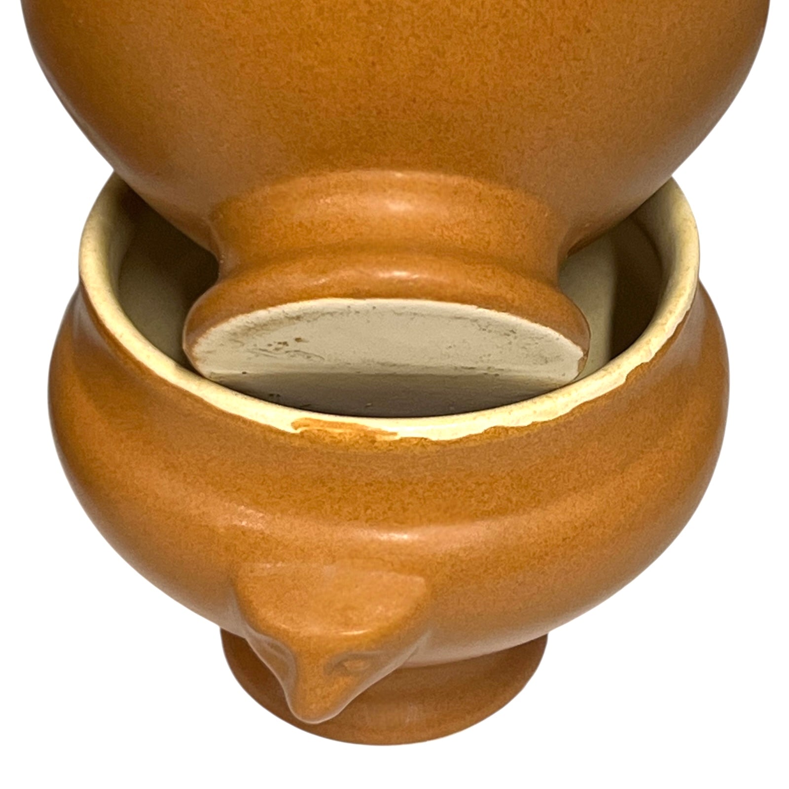 light brown ceramic French soup bowls with lions head handles on a white background 
