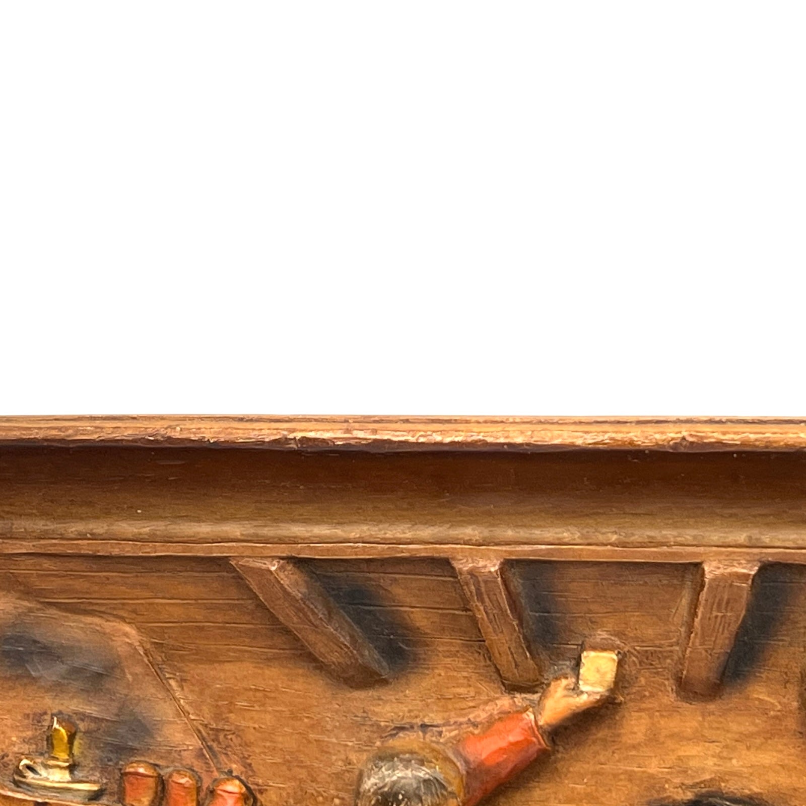 close up of wooden relief sculpture in an arts and crafts style on a white background