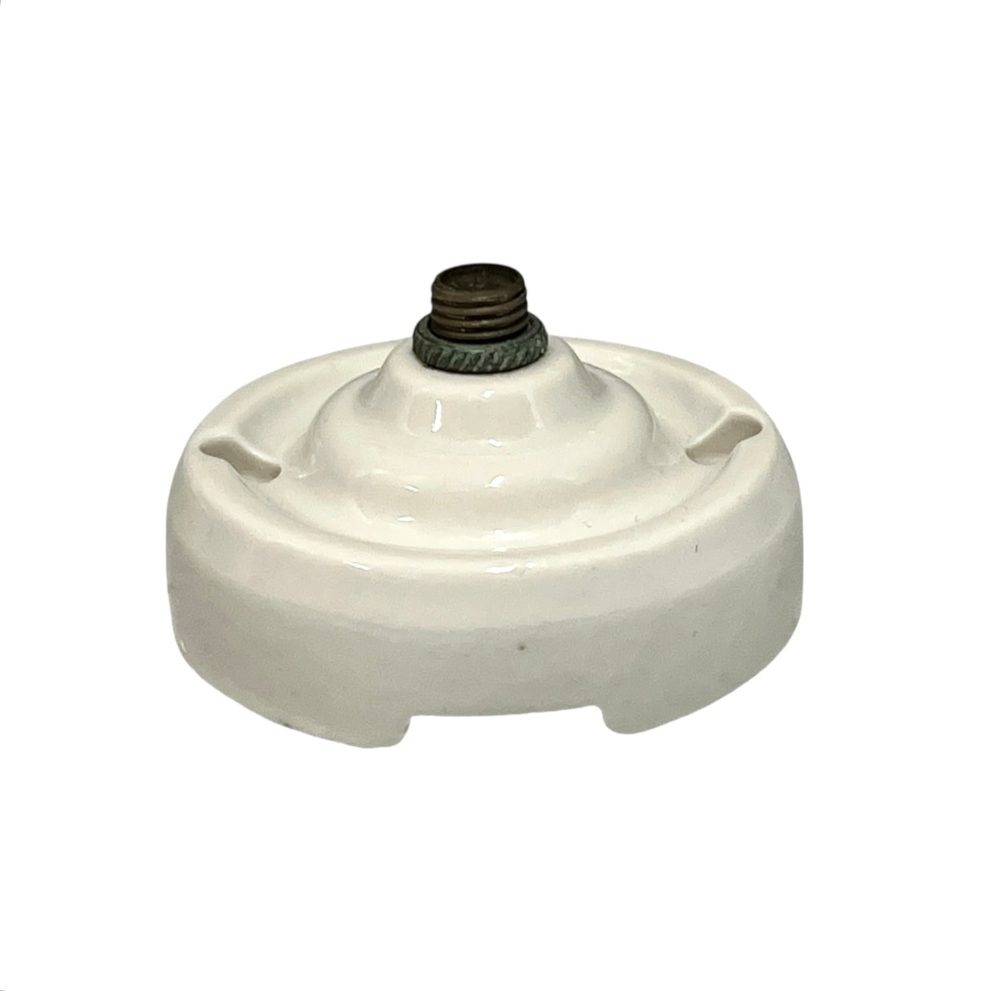 Small vintage French porcelain ceiling rose with a brass nut on a white background 