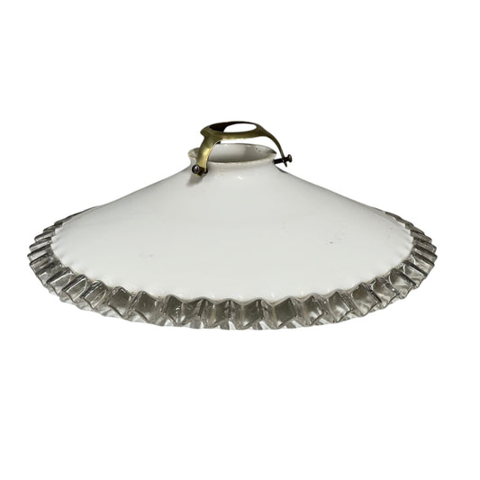White round vintage glass lampshade with a frilled clear edge and a brass collar on a white background
