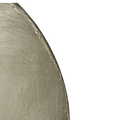 Close-up of a copper pan lid with brand new tin lining on a white background