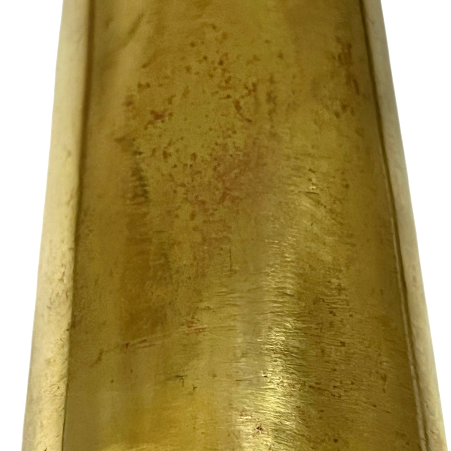 Close-up of a brass trench art shell case on a white background 