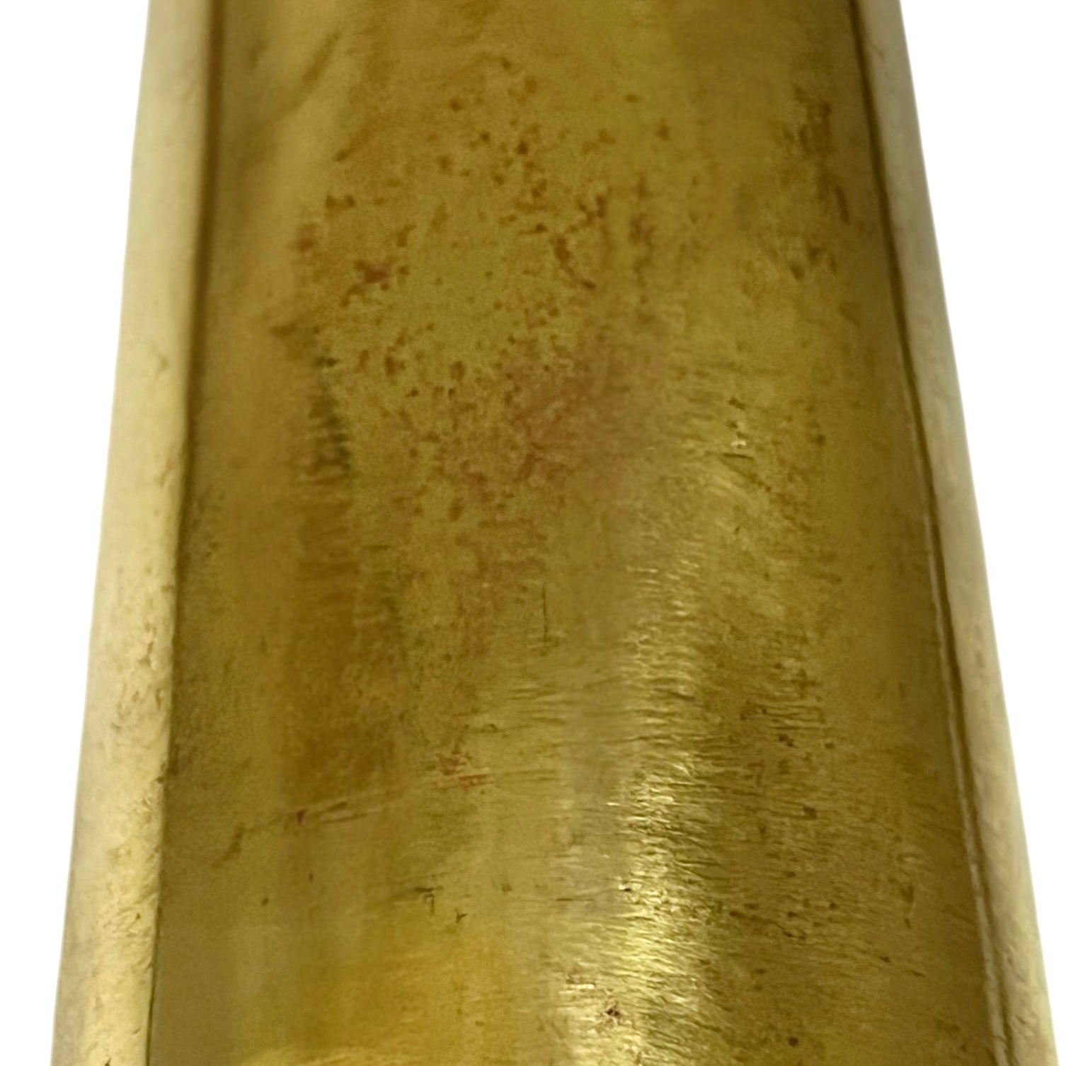 Close-up of a brass trench art shell case on a white background 