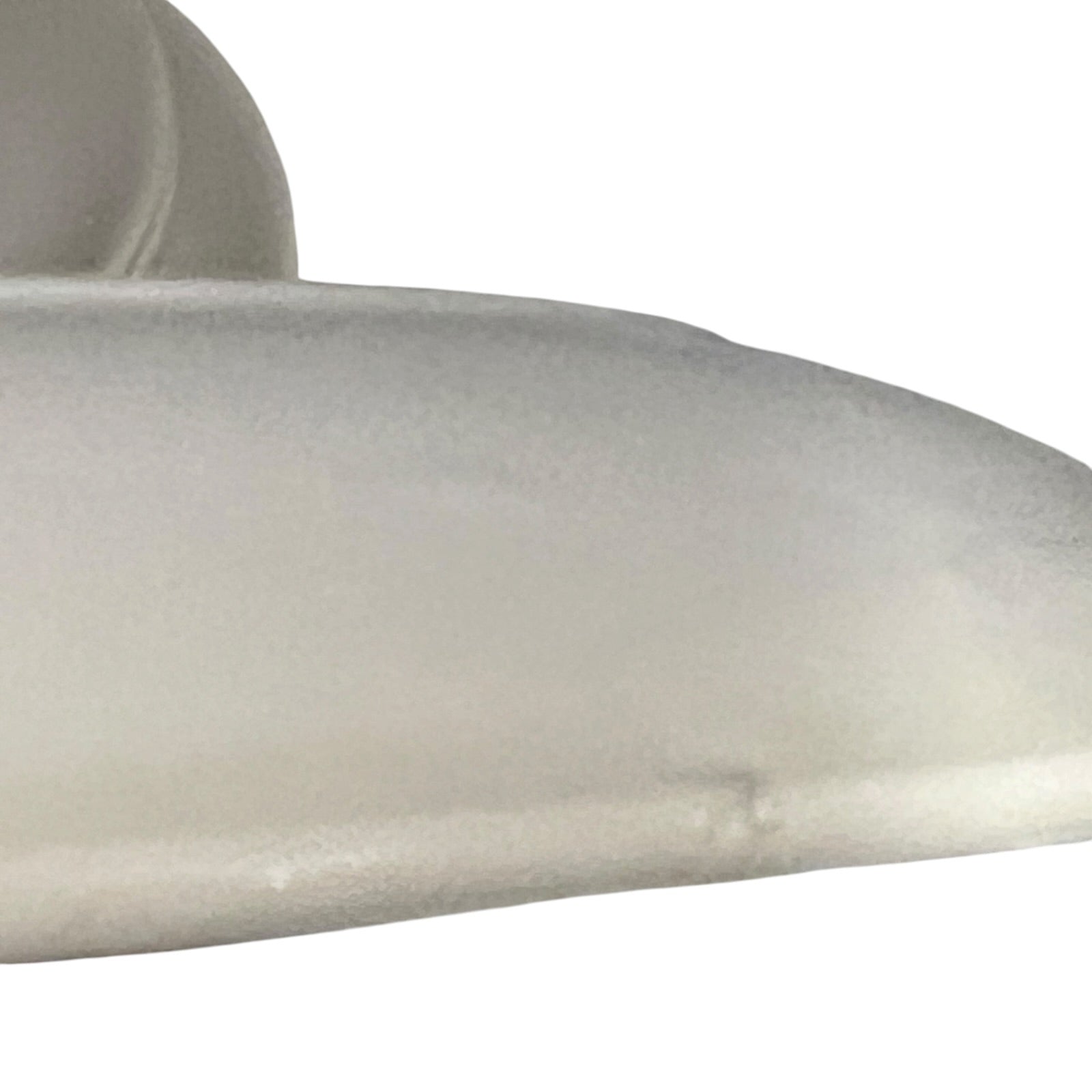 Close-up of a beige ceramic bowl on a white background