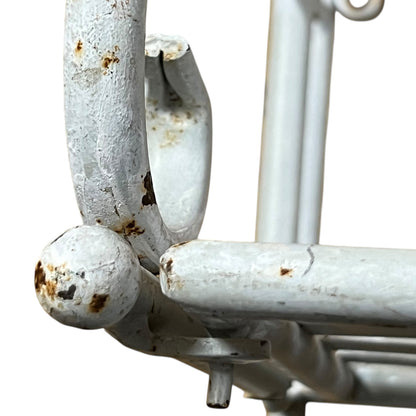 Close-up of a metal she with visible wear and tear on a white background