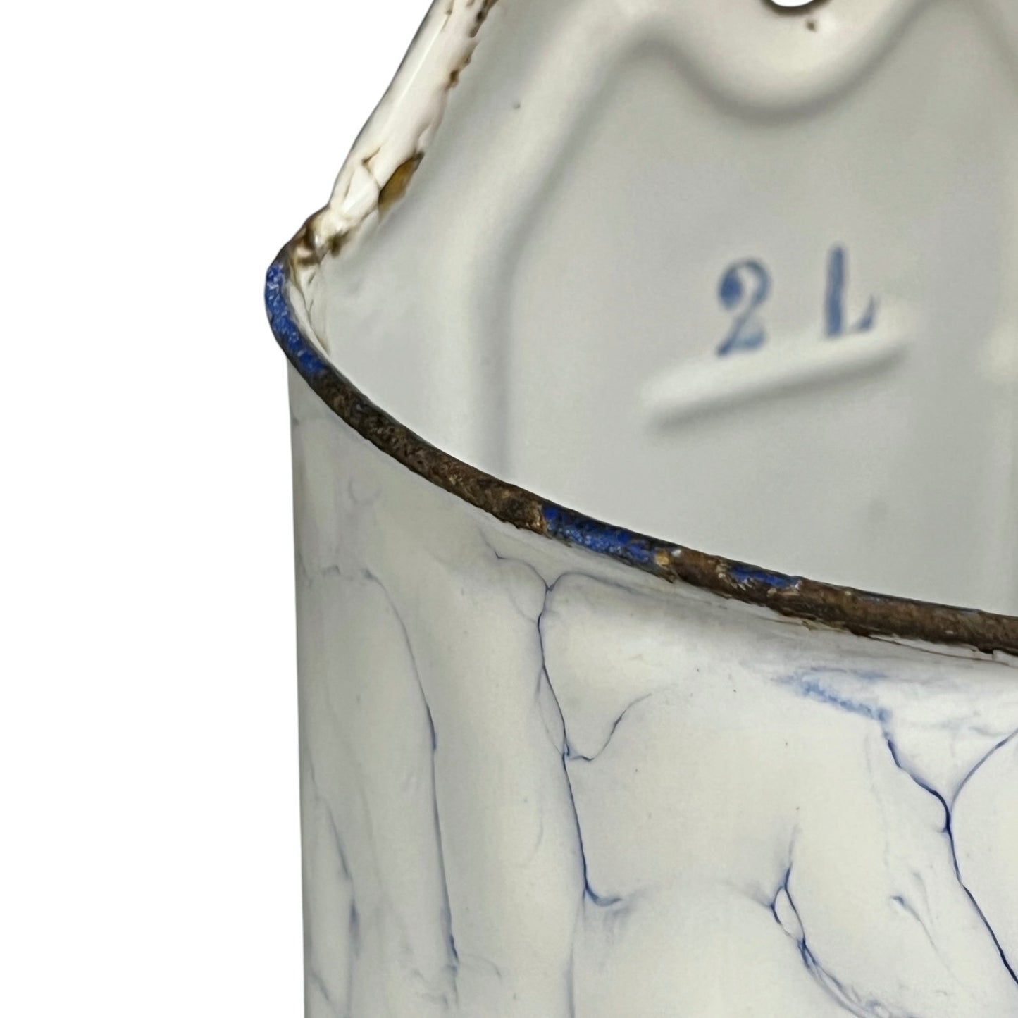 Close-up of a vintage white enamel pot with blue crackled veins, a dark metal rim with blue paint, and a stamped '2 L' marking inside.