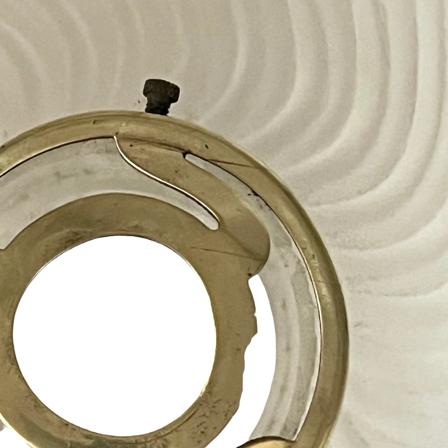 Close up of a glass lampshade on a white background 