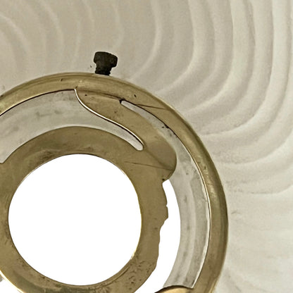 Close up of a glass lampshade on a white background 