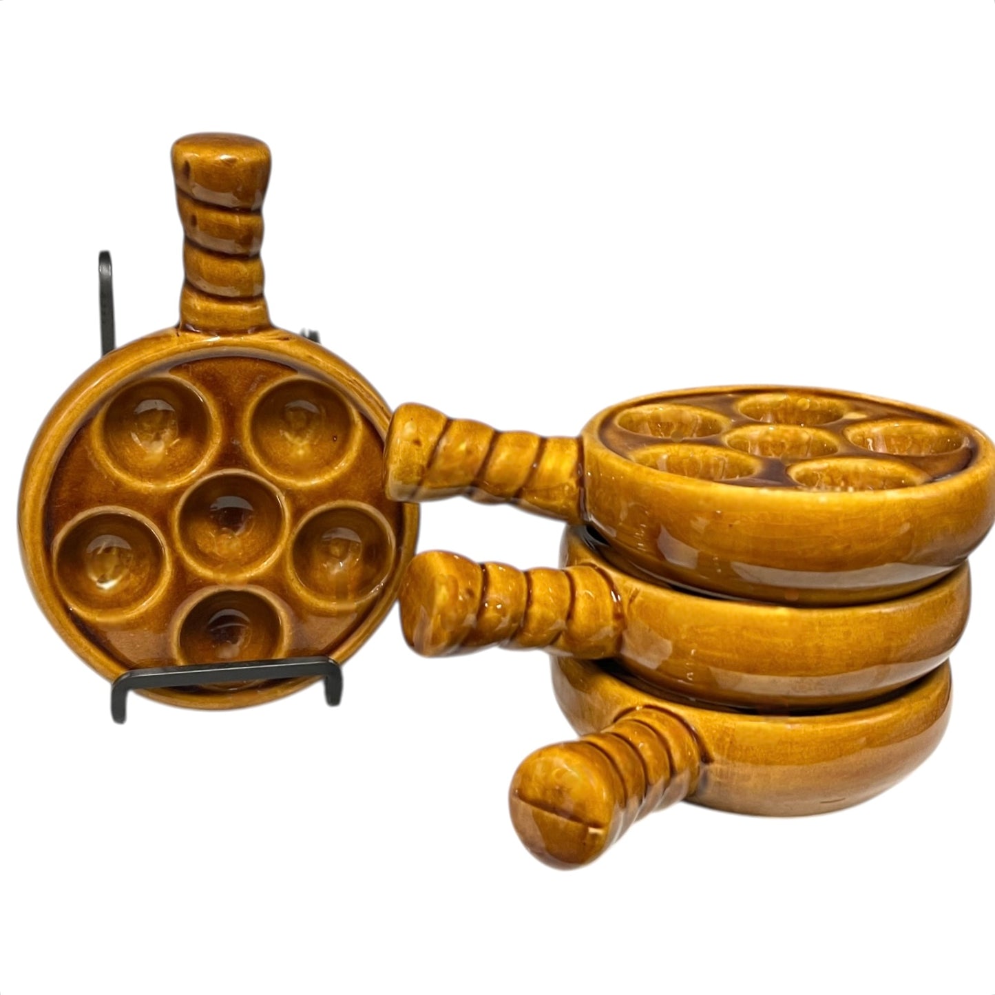 French brown ceramic escargots pots with multiple compartments on a white background