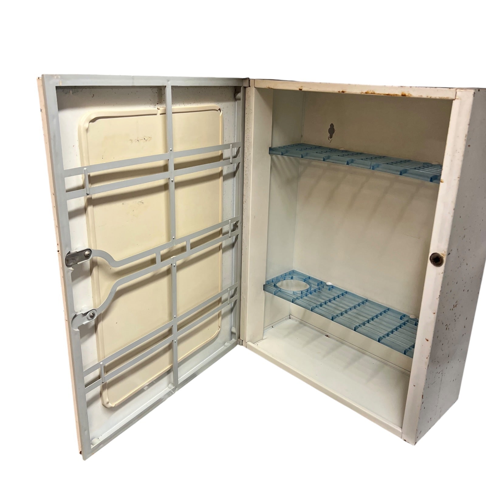 close up of a vintage metal bathroom cabinet inside view on a white background