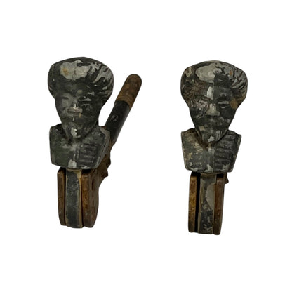 Close up of vintage male head shutter dogs 
