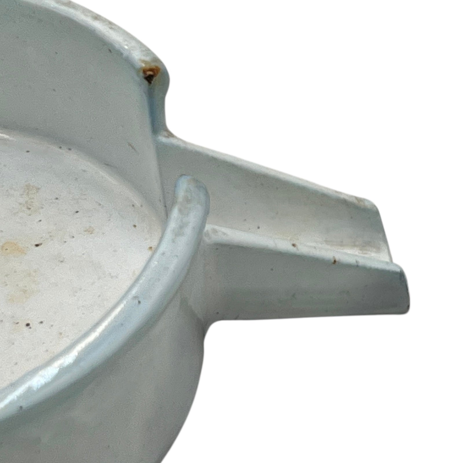 Close-up of a vintage French fruit press with an enamel pot on a white background