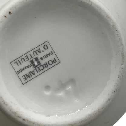 Close-up of a Porcelaine de France logo on a ceramic product