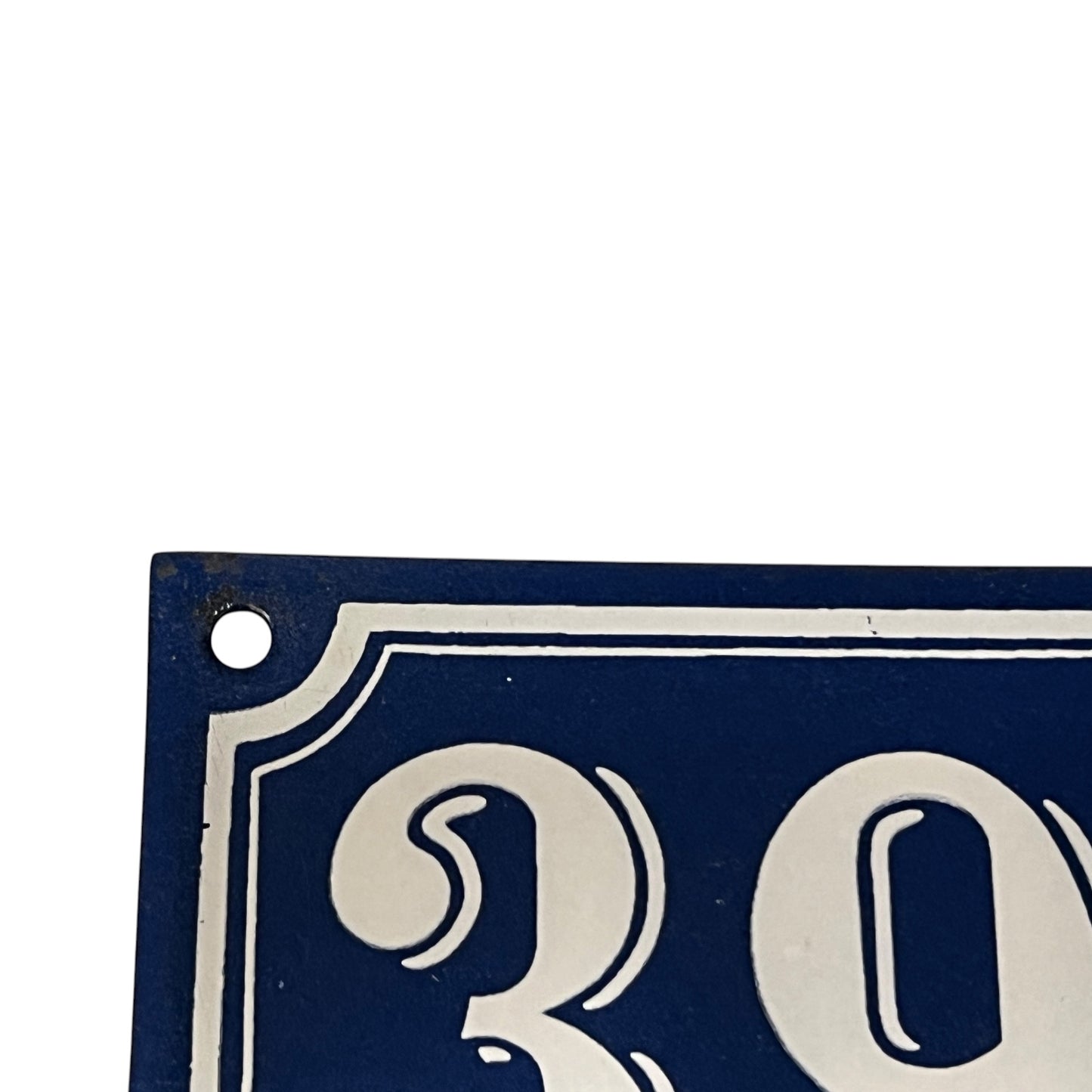 Close-up of a blue and white sign with 'ROY' on it