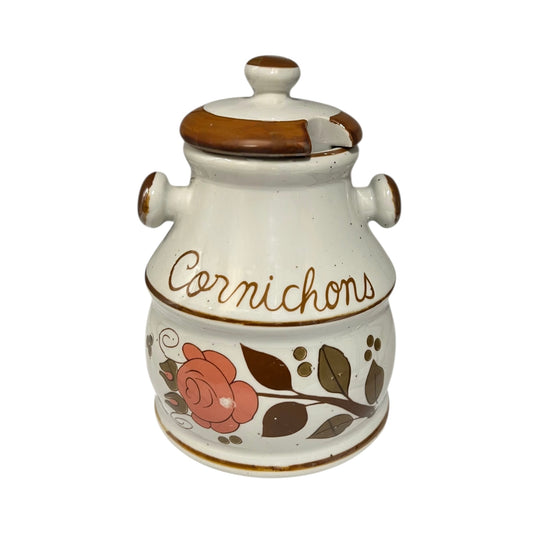 Ceramic jar with floral design and 'Cornichons' text on a white background