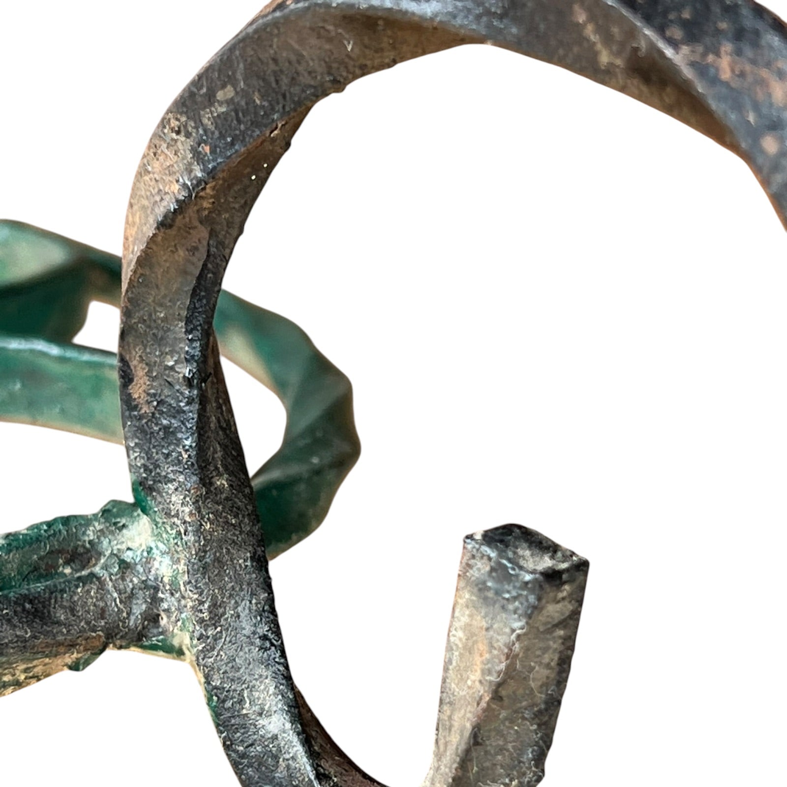 Close up of a wrought iron vintage plant stand on a white background 