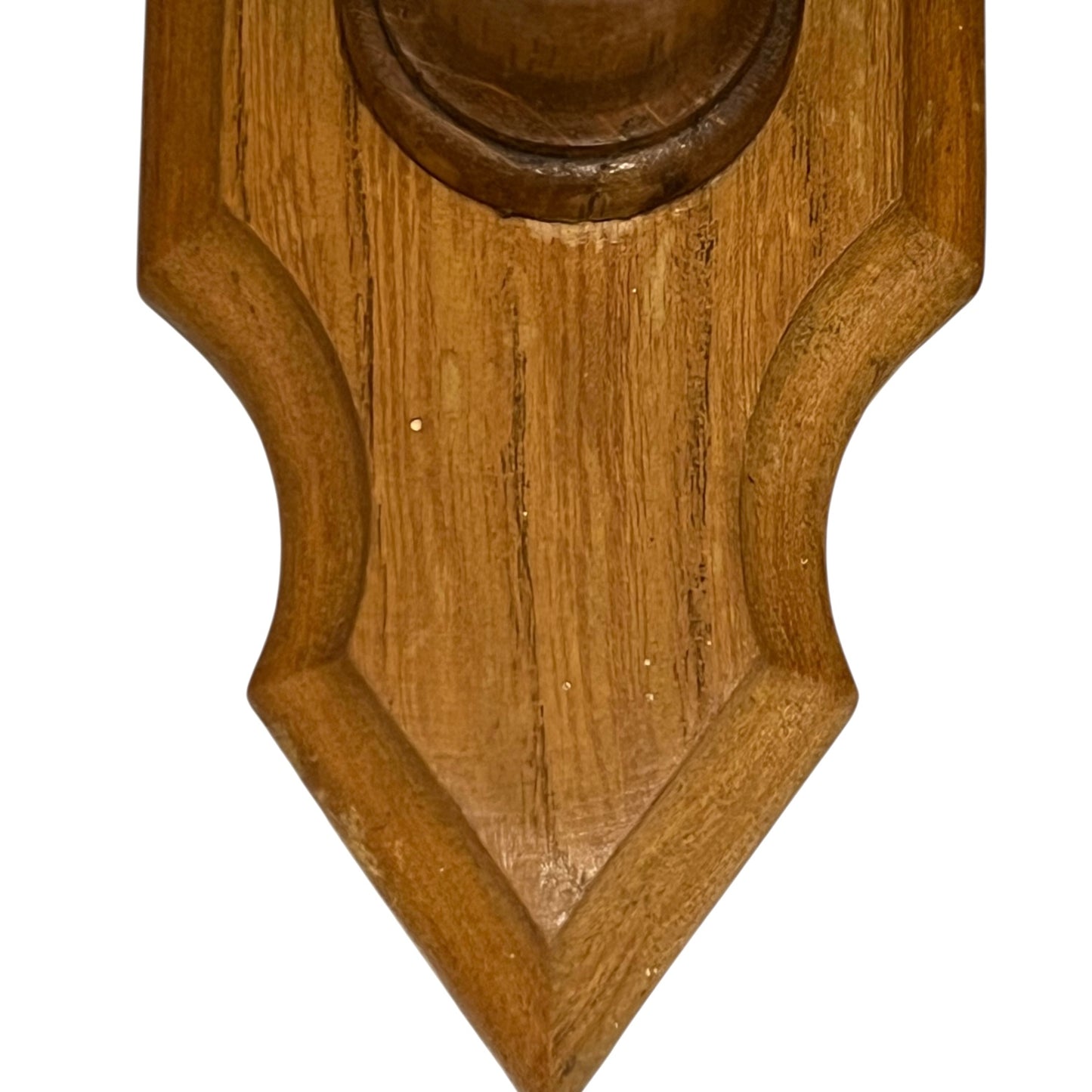 Close up of deer hoof hooks on wooden mounts on a white background