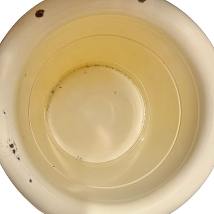 Close up of a French enamel bucket on a white background 