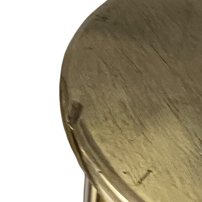 Close up of a brass WW1 German shell case on a white background