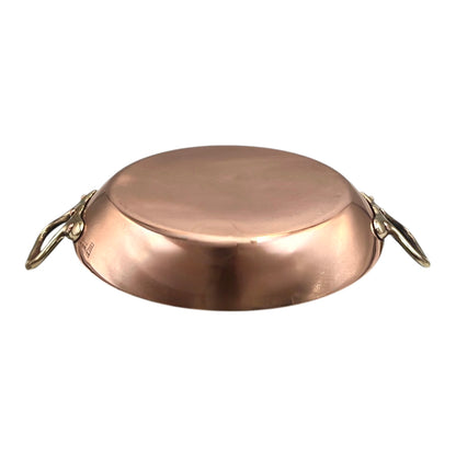 French copper round gratin pan with brass handles on a white background for sale from All Things French Store