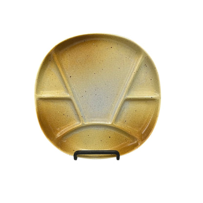Brown mid century ceramic divided plate with a textured finish on a white background