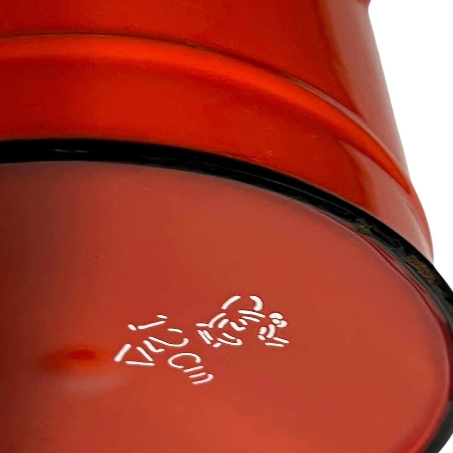 Close-up of a red teapot on a white background