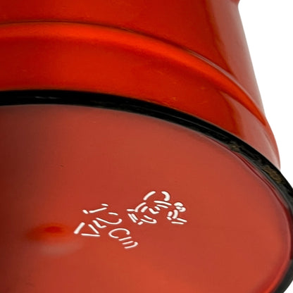 Close-up of a red teapot on a white background