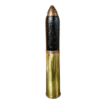 British WW1 18 pounder militaria relic trench art, a brass shell, a black shrapnel case and a brass fuse, upright, for display or militaria gift, set on a white background 