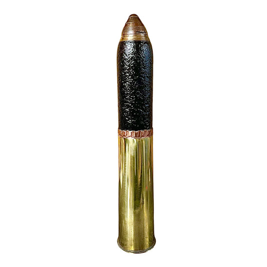 British WW1 18 pounder militaria relic trench art, a brass shell, a black shrapnel case and a brass fuse, upright, for display or militaria gift, set on a white background 